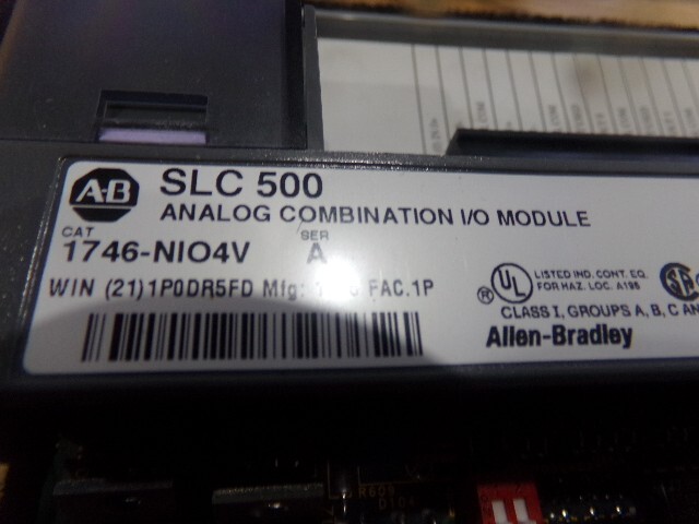 Allen Bradley Cat. #: 1746-NIO4V Analog Combination I/O Module. Series: A